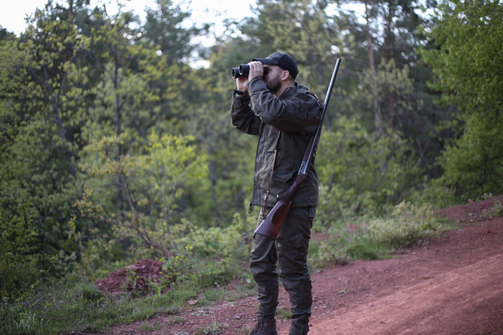 Man looking through binoculars.